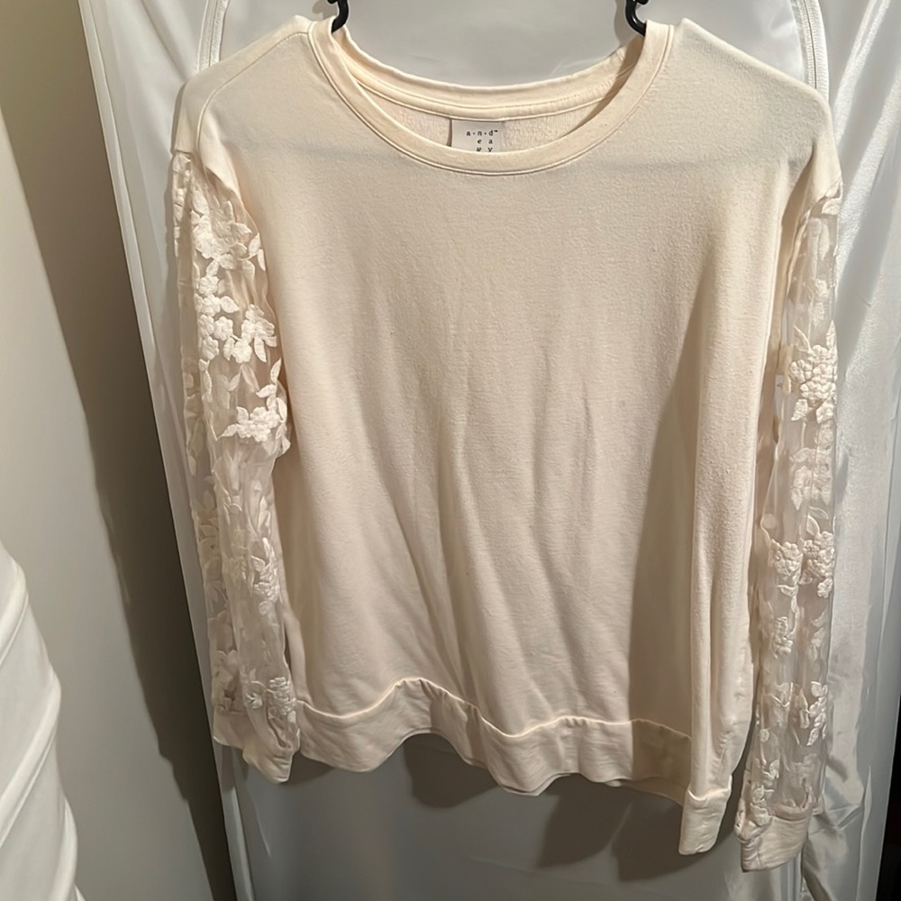 Super comfy and chic, cream shirt with sheer embroidered sleeves.